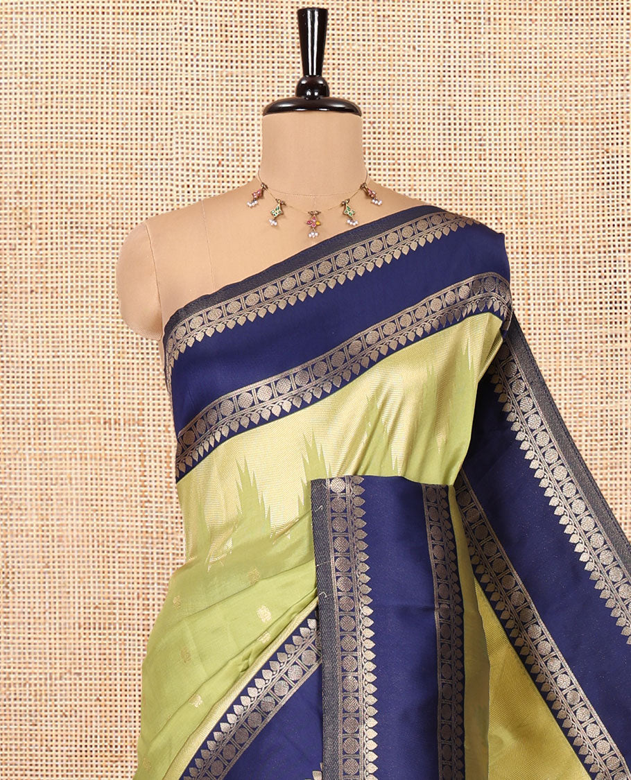 Pista Green Litchi Saree, Bedecked with Peacock Buttas , Contrast Temple Traditional Rettai Pettu Border, Pallu of Traditional , and Contrast Blouse