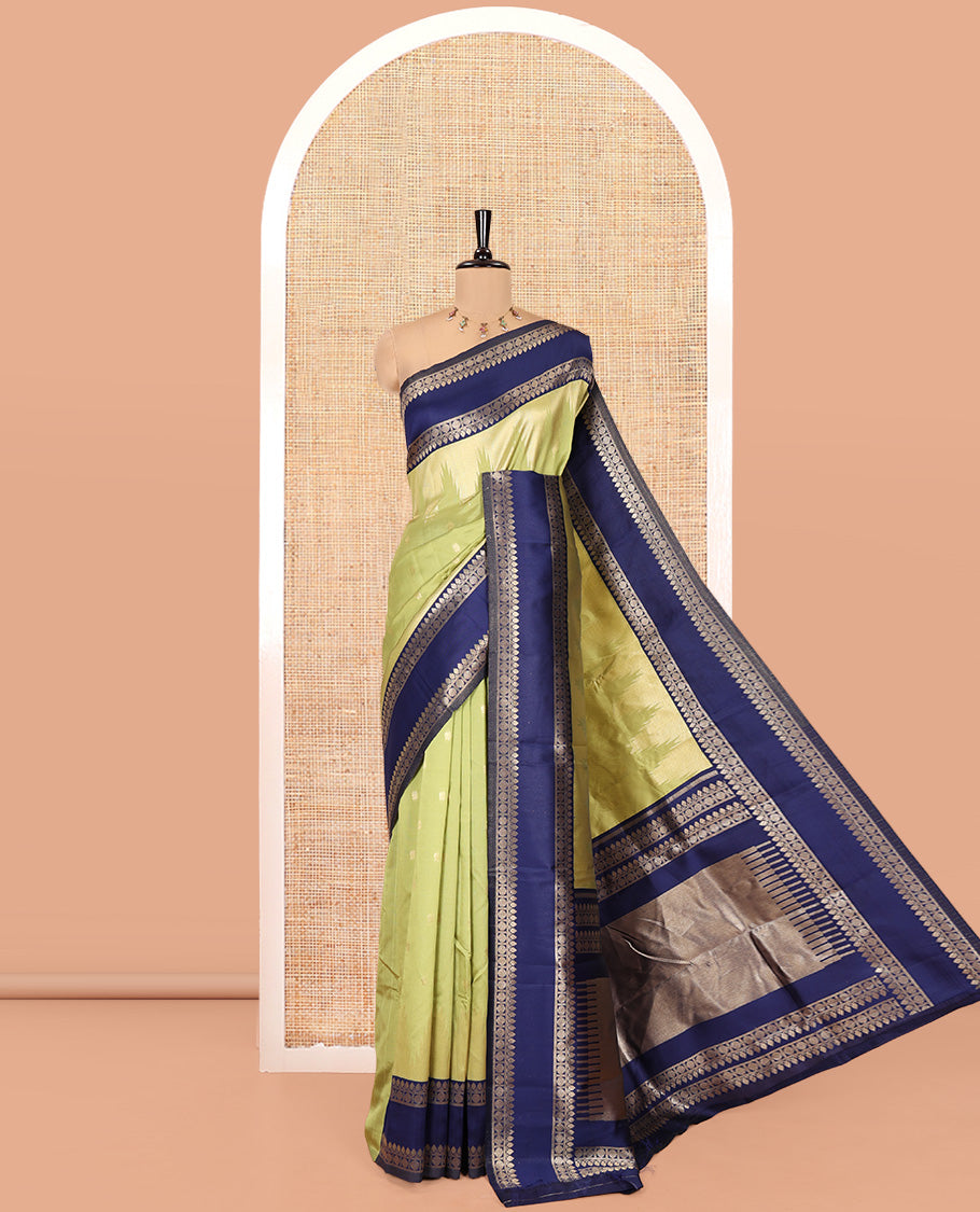 Pista Green Litchi Saree, Bedecked with Peacock Buttas , Contrast Temple Traditional Rettai Pettu Border, Pallu of Traditional , and Contrast Blouse