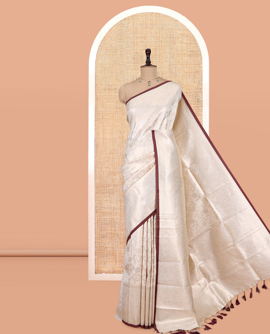 Off-White-Brown Semi-Silk Saree, Adorned with Floral Jacquard Design, a Zari Paisley Border, and a Contrast Blouse