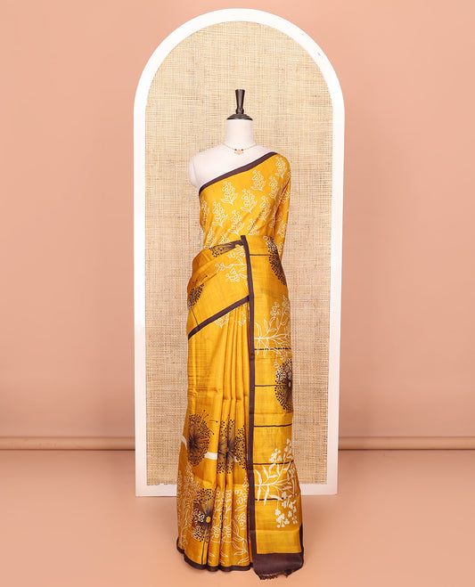 Mustard floral motifs printed saree, contrast piping border, and floral printed pallu