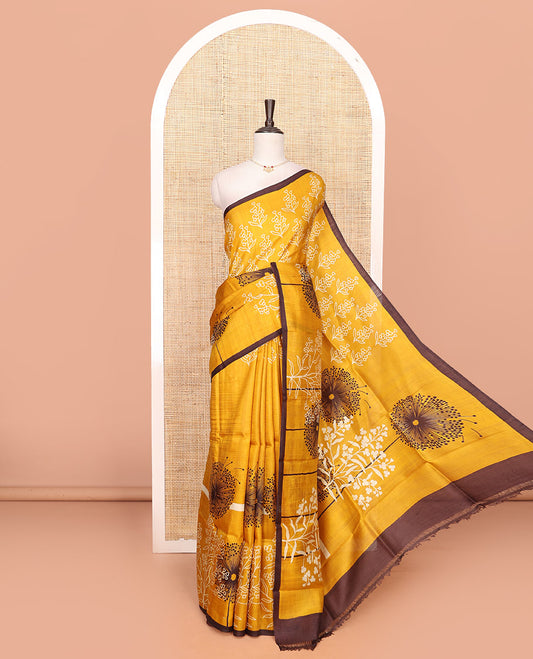 Mustard floral motifs printed saree, contrast piping border, and floral printed pallu