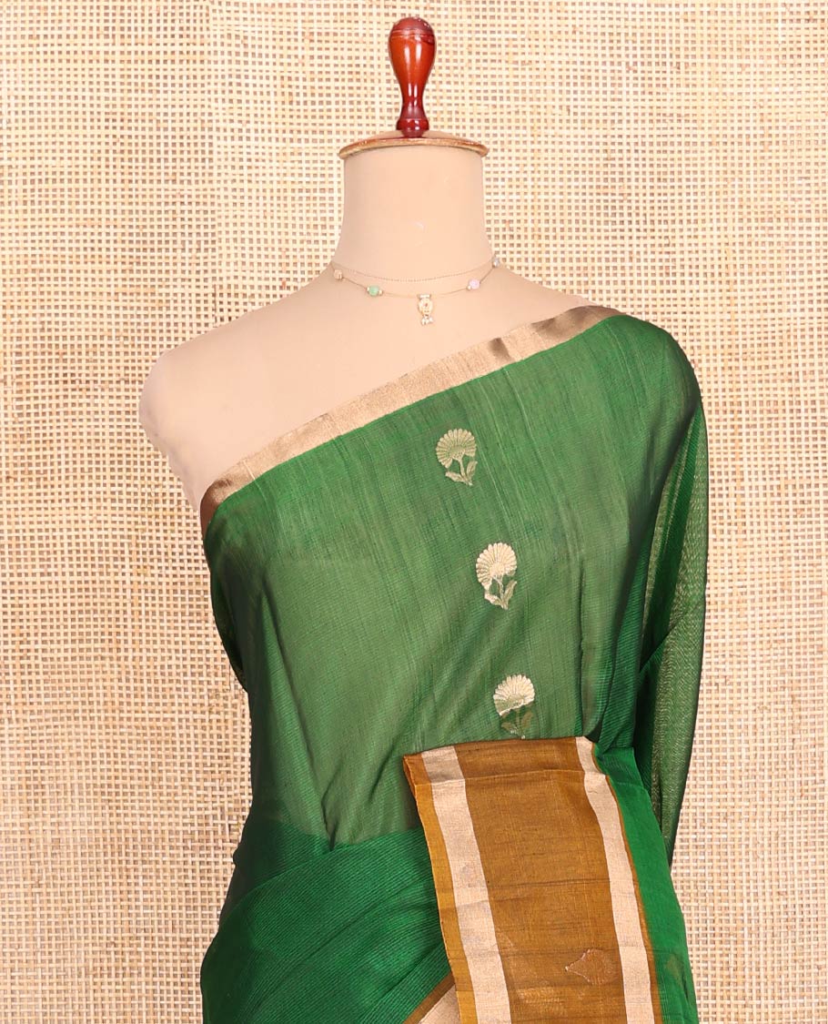 Green Silk Cotton Saree, Spotlighted with Floral Zari Buttas All Over Its Body, Complemented by a Contrast Zari Design Border, Pallu Features Floral and Paisley Designs, and Paired with a Contrast Blouse