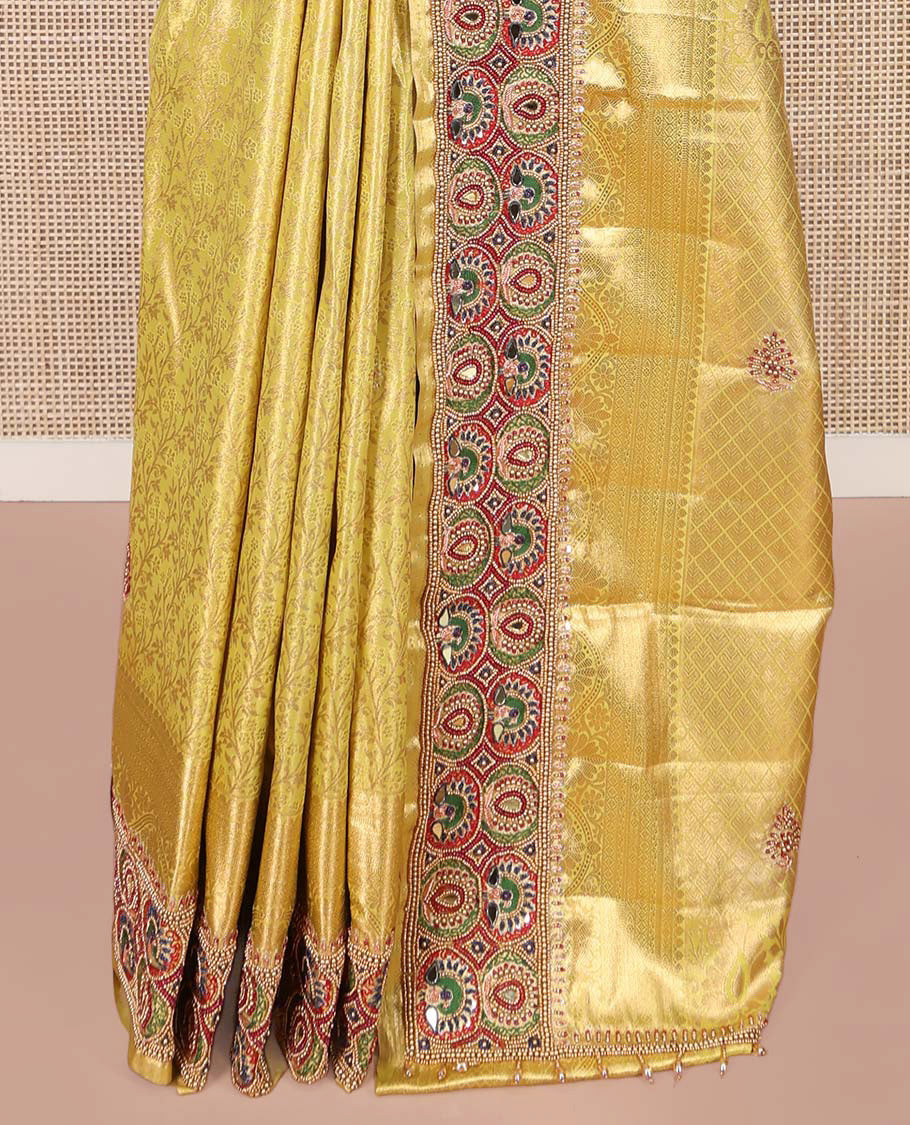 Yellow Vastrakala Silk Saree, Artfully Detailed with Floral Jacquard and Patch Work, Complemented by Mixed Intricately Embroidered Border, Grand Jaal Design Stone Work Pallu, and Paired with Heavy Embroidered Blouse