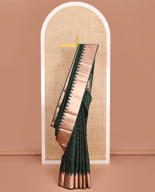 Green Vasundhara Lite-Silk Mix Saree, Spotlighted with Zari Buttas All Over Its Body, Highlighted by a Thazampoo Rekku Border, Meticulously Crafted Pallu, and Paired with a Matching Blouse