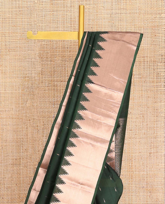 Green Vasundhara Lite-Silk Mix Saree, Spotlighted with Zari Buttas All Over Its Body, Highlighted by a Thazampoo Rekku Border, Meticulously Crafted Pallu, and Paired with a Matching Blouse