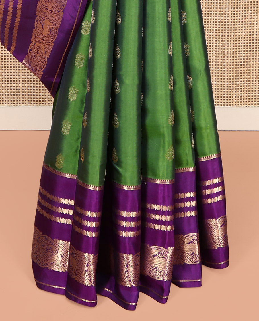 Green Vasundhara Lite-Silk Mix Saree Featuring Zari Buttas, a Contrast Rekku Border of Rudraksham, Round Mayil, and Round Yaali Designs, Grand Pallu, and a Contrast Blouse