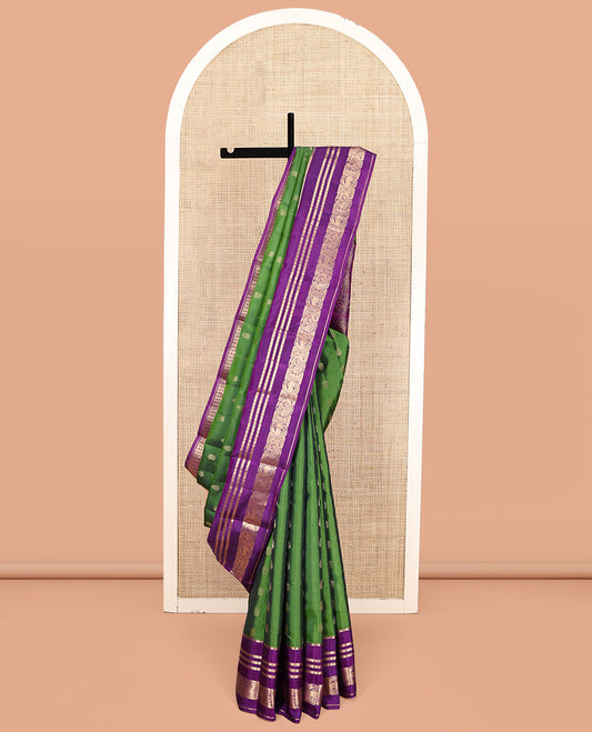 Green Vasundhara Lite-Silk Mix Saree Featuring Zari Buttas, a Contrast Rekku Border of Rudraksham, Round Mayil, and Round Yaali Designs, Grand Pallu, and a Contrast Blouse