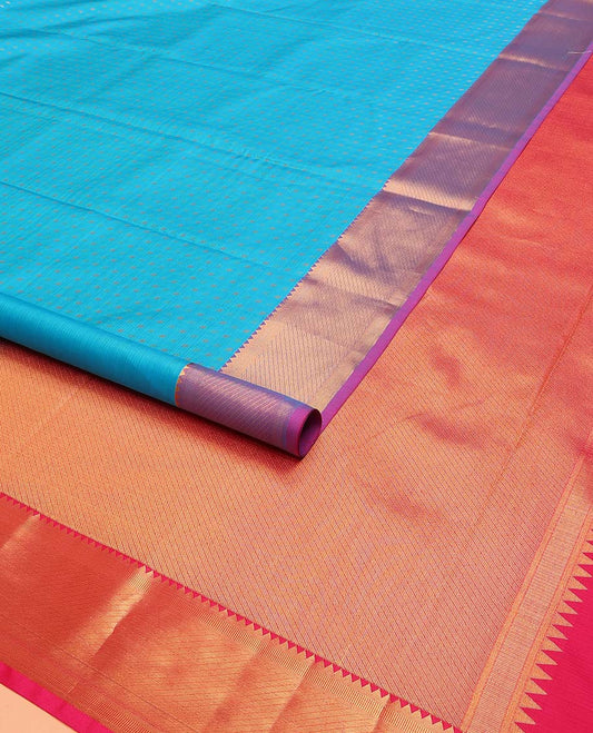 Blue Vasundhara Lite Silk Mix Saree Subtly Sparked with Zari Buttas, Complemented with a Contrast Border Featuring Rekku, Banaras, and Zari Designs, Pallu Features Zari Designs, and Paired with a Contrast Blouse