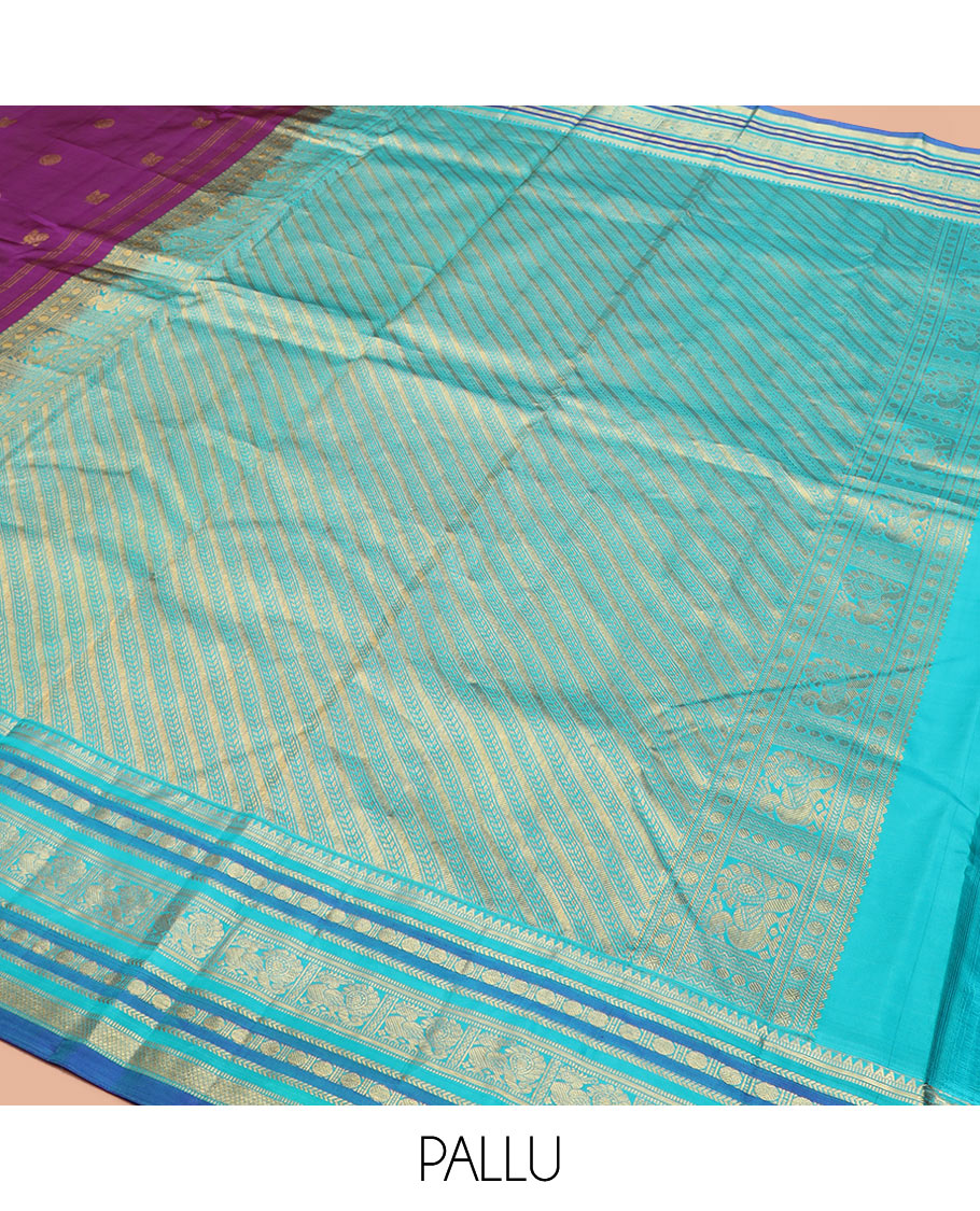 Purple Vasundhara Silk Saree Detailed with Mayil Chakram Buttas, Complemented by a Contrast Varisai Pettu Border of Rekku, Muthu, Kathir, Rudraksham, Mayil, and Mayil Kann Designs, Gleaming Pallu of Diagonal Stripes, and Paired with a Contrast Blouse
