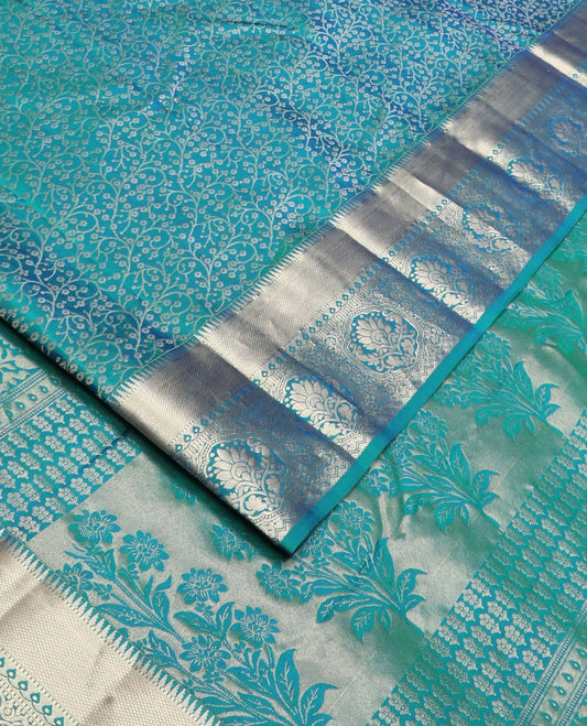 Blue jacquard Kanchipuram wedding silk saree, zari border of rekku, kuyil kann, thilakam mokku, Muthu, and floral design, and floral design pallu