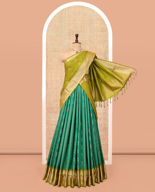 Green Art Silk Half-Saree Pavadai Material Gleamed Up with Zari-Buttas Skirt, a Contrast Traditional Border, Contrast Blouse, and Intricate Dhavani
