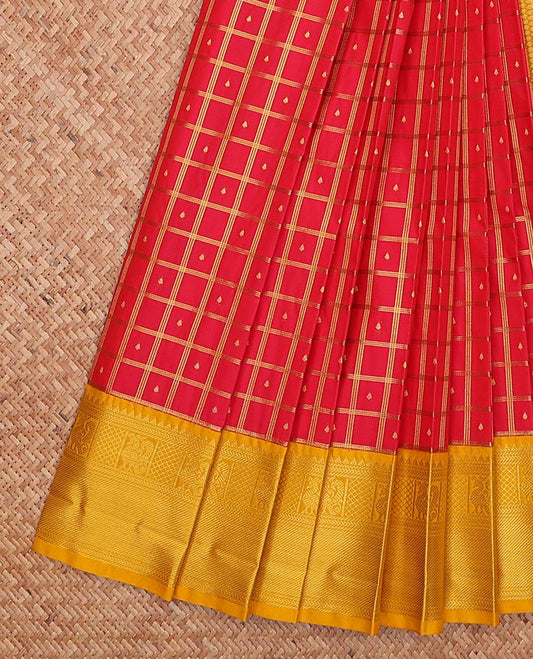 Red butta enclosed checked gift saree, contrast traditional zari design border, and jaal pallu