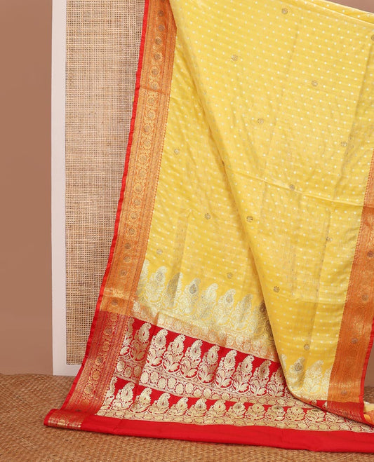 Yellow buttas semi banaras nylon with contrast floral design border & floral design pallu