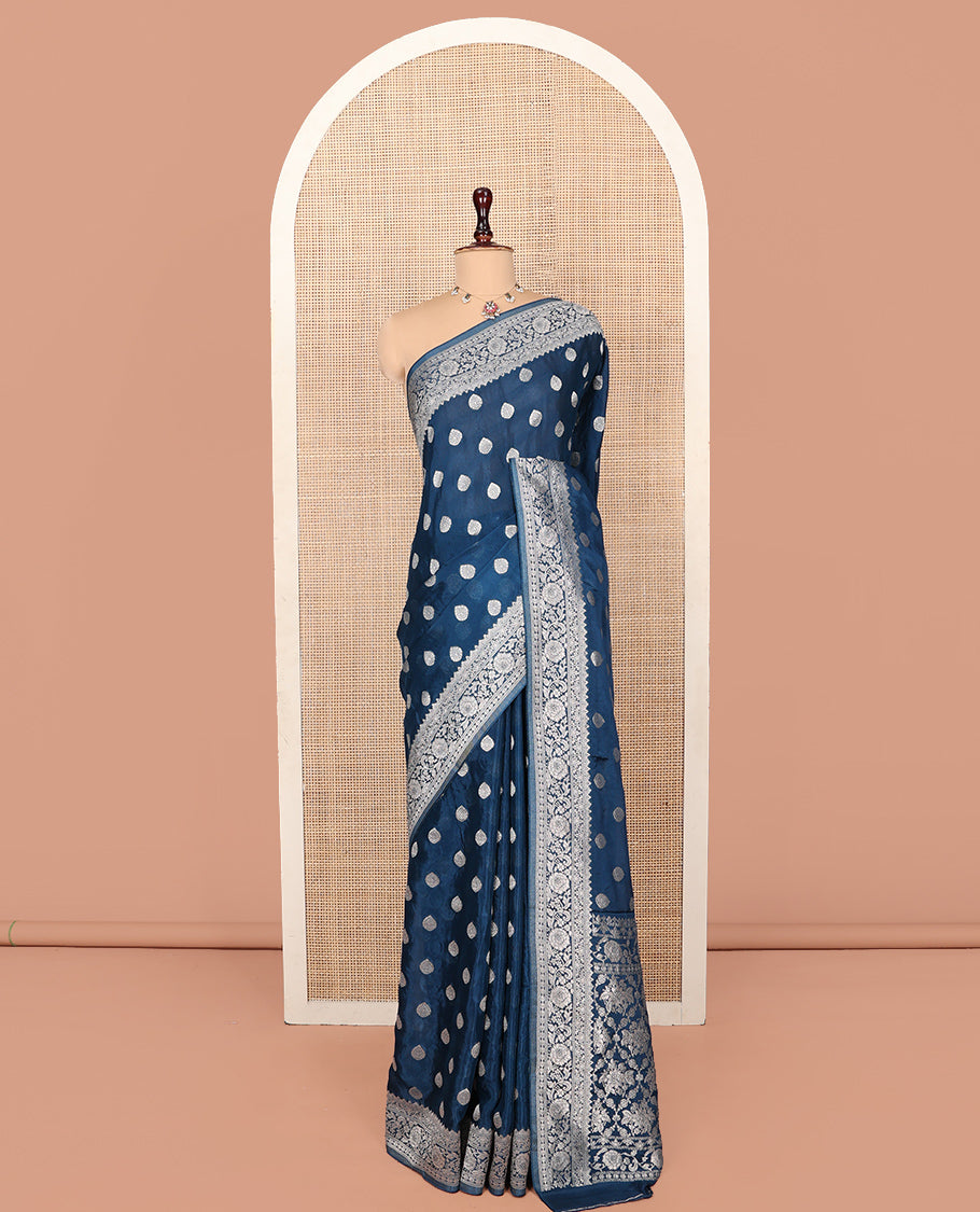 Blue Fancy Crepe Saree, Gleamed Up with Thilakam Buttas, Highlighted by a Traditional Border, Intricately Designed Pallu, and a Matching Blouse