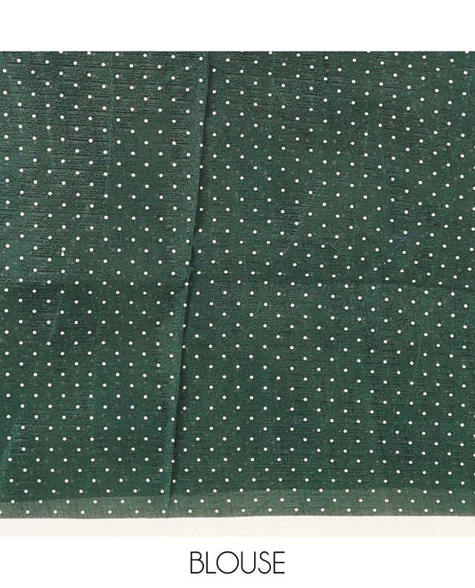 White base saree steeped with big green polka dots, plain border, and pallu of polka dots