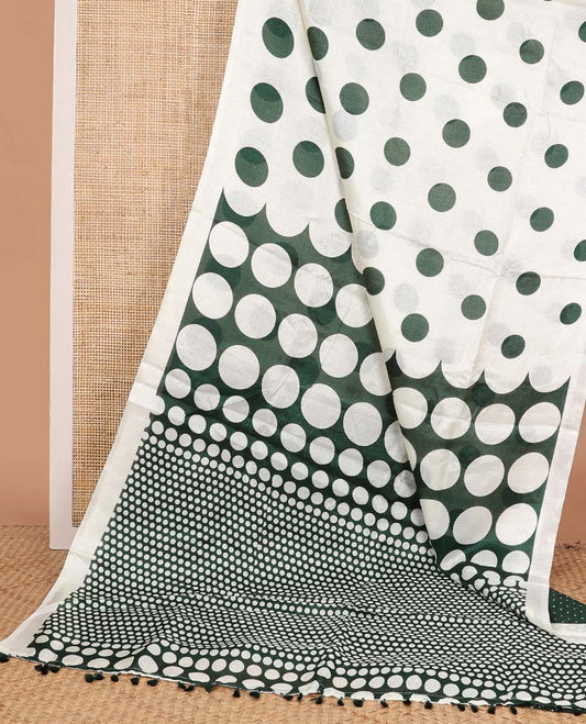 White base saree steeped with big green polka dots, plain border, and pallu of polka dots