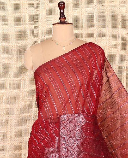 Borderless Red Semi-Silk Cotton Saree, Gracefully Embellished with Traditional Zari Designs on Its Body, Highlighted by Pallu of Chevron Designs, and Paired with a Matching Blouse