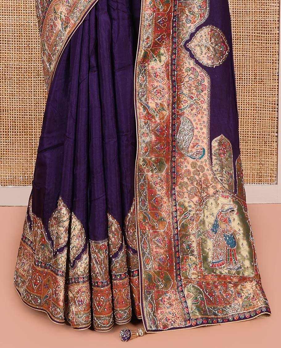 Violet Dola Silk Saree, Uniquely Detailed with Patch Embroidery on Its Body, Highlighted by a Patch Embroidered Border, Pallu Depicts Flora, Fauna, and Human Design Embroidery, and Paired with a Matching Blouse
