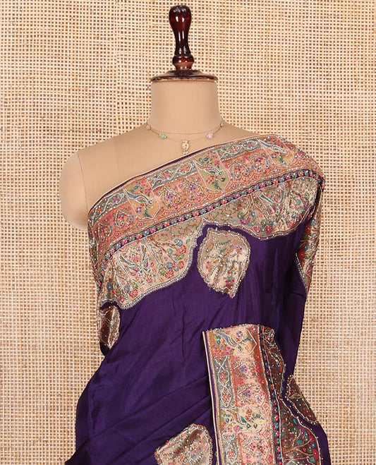 Violet Dola Silk Saree, Uniquely Detailed with Patch Embroidery on Its Body, Highlighted by a Patch Embroidered Border, Pallu Depicts Flora, Fauna, and Human Design Embroidery, and Paired with a Matching Blouse