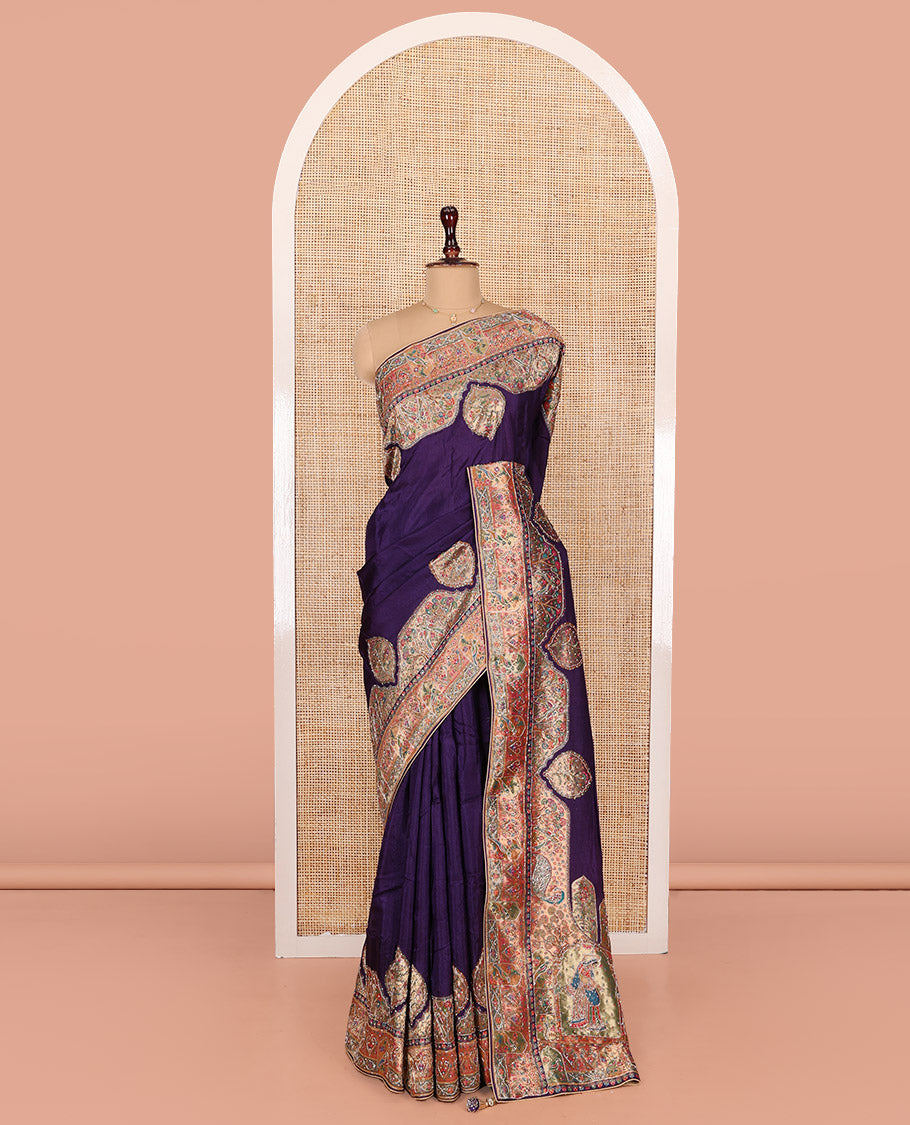 Violet Dola Silk Saree, Uniquely Detailed with Patch Embroidery on Its Body, Highlighted by a Patch Embroidered Border, Pallu Depicts Flora, Fauna, and Human Design Embroidery, and Paired with a Matching Blouse