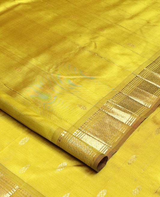 Green zari buttas Kanchipuram silk saree, one-sided zari border of paneer sombu, banaras, muthu, and jaal designs, and zari design pallu