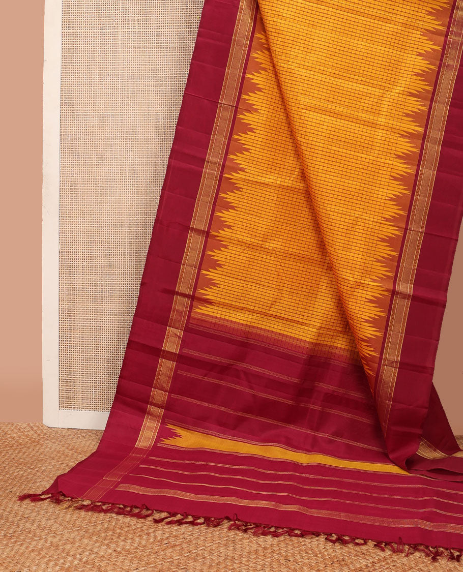 Yellow micro-checked kanchipuram silk saree, contrast thazampoo rekku striped border & pallu of stripes & pillaiyar mokku designs
