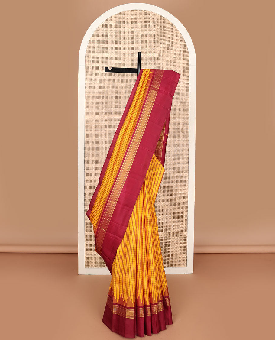 Yellow micro-checked kanchipuram silk saree, contrast thazampoo rekku striped border & pallu of stripes & pillaiyar mokku designs