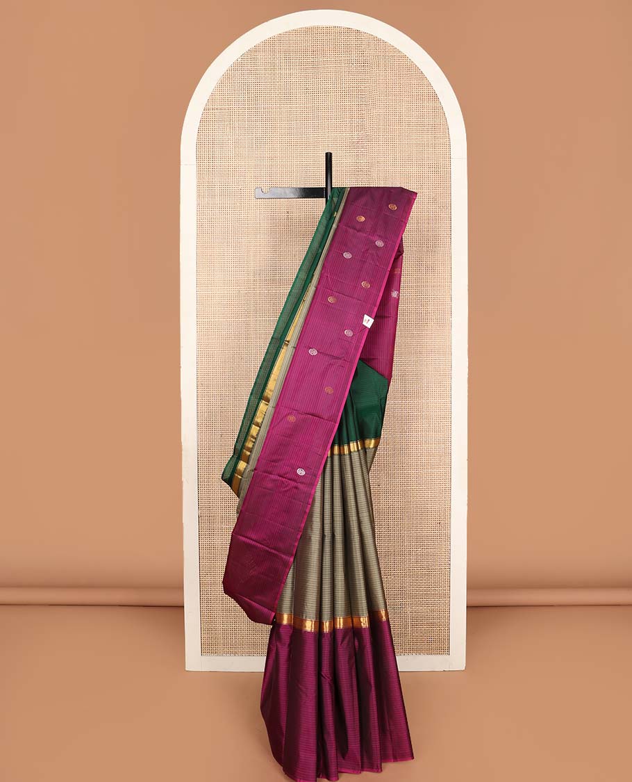 Grey striped Kanchipuram silk saree with contrast ganga-jamuna broad border of chakram motifs, and pallu steeped with chakram motifs