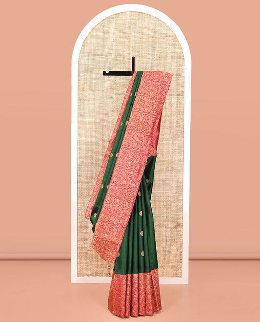 Green Kanchipuram Designer Silk Saree, Entralled with Chakram Buttas All Over Its Body, Complemented by Contrast Historically Woven Border of Yaali and Yaanai Designs, Grand Jaal Pallu and Paired with a Contrast Blouse