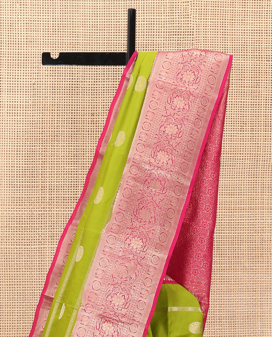 Parrot Green Vasundhara Silk Saree Featuring Veldhari and Round Kuthirai Motifs, Complemented by a Contrast Border of Thilakam Mokku, Muthu, Annam Chakram, and Kodi Visiry Designs, Pallu Elevated with Floral Designs, and Paired with a Contrast Blouse