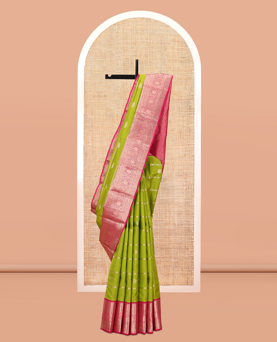 Parrot Green Vasundhara Silk Saree Featuring Veldhari and Round Kuthirai Motifs, Complemented by a Contrast Border of Thilakam Mokku, Muthu, Annam Chakram, and Kodi Visiry Designs, Pallu Elevated with Floral Designs, and Paired with a Contrast Blouse