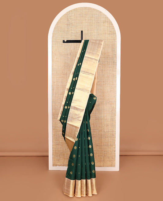 Green Vasundhara Lite Silk Mix Saree Spotlighted with Zari Buttas, Complemented by a Contrast Border Depicting Paneer Sombu, Muthu, Dhavana Kodi, Mayil Kann, Neli, and Lavangam Designs, Featuring a Zari-Elevated Jaal Pallu, Paired with a Contrast Blouse