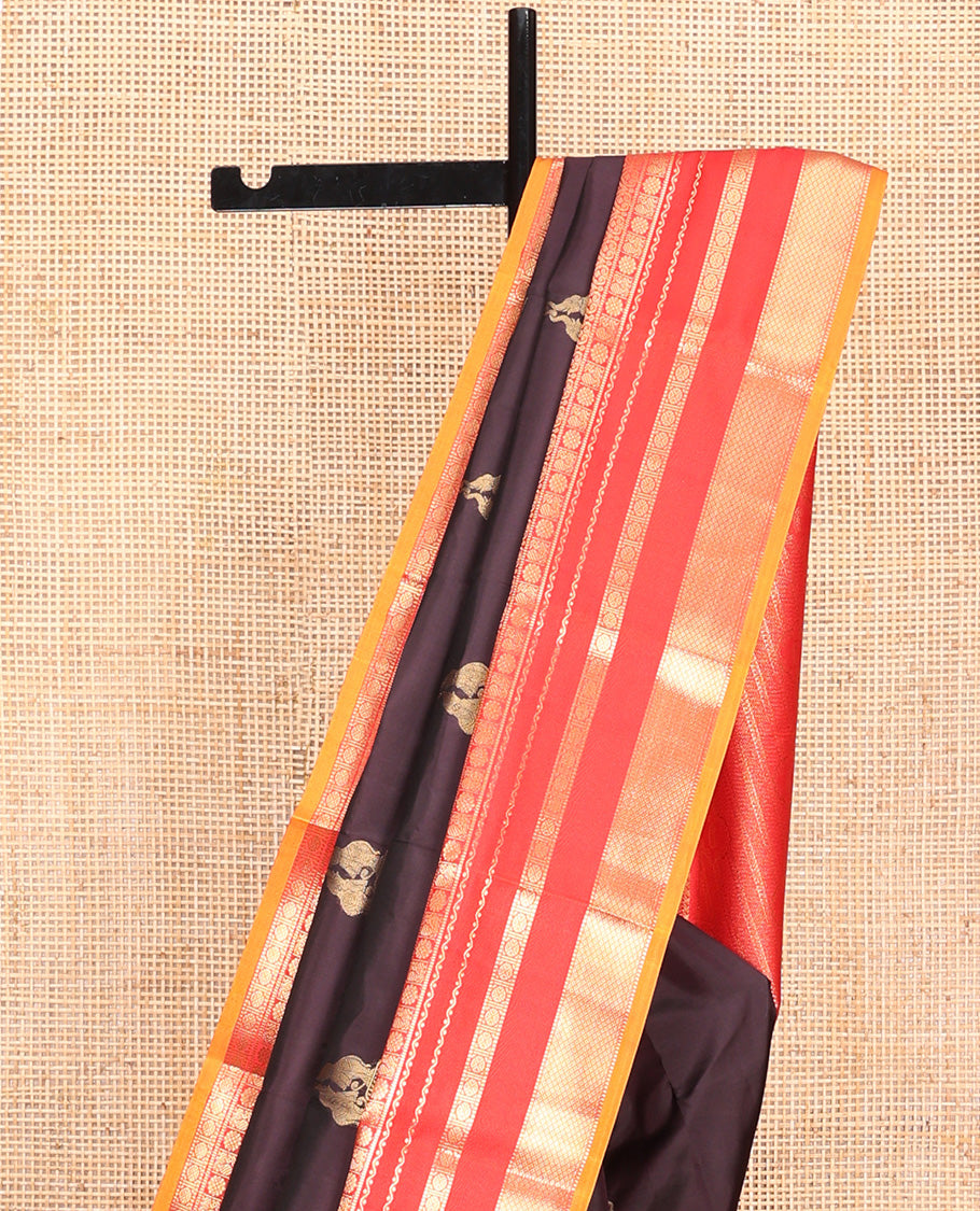 Brown Vasundhara Lite Silk Mix Saree, Delicately Woven with Yaanai Buttas, Complemented by Contrast Border of Rekku, Muthu, Jada Nagam, Laddu Kamalam, Mayil, Rudraksham, and Mayil Kann Designs, Grand Pallu and Paired with a Contrast Blouse