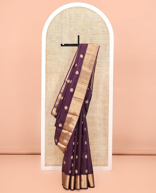 Brown Vasundhara Lite Silk Mix Saree, Detailed with Zari Buttas All Over Its Body, Highlighted by a Zari Border of Thilakam Mokku, Neli, and Muthu Designs, Ogee-Patterned Pallu, and Paired with a Matching Blouse