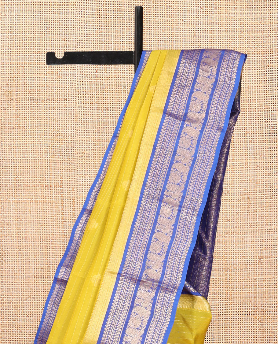 Green Vasundhara Lite Silk Mix Saree, Beautified with Zari Buttas and Checks, a Contrast Border of Kathir, Neli, Rekku, Thilakam Mokku, Manga, and Mayil Designs, Grand Pallu, and a Contrast Blouse