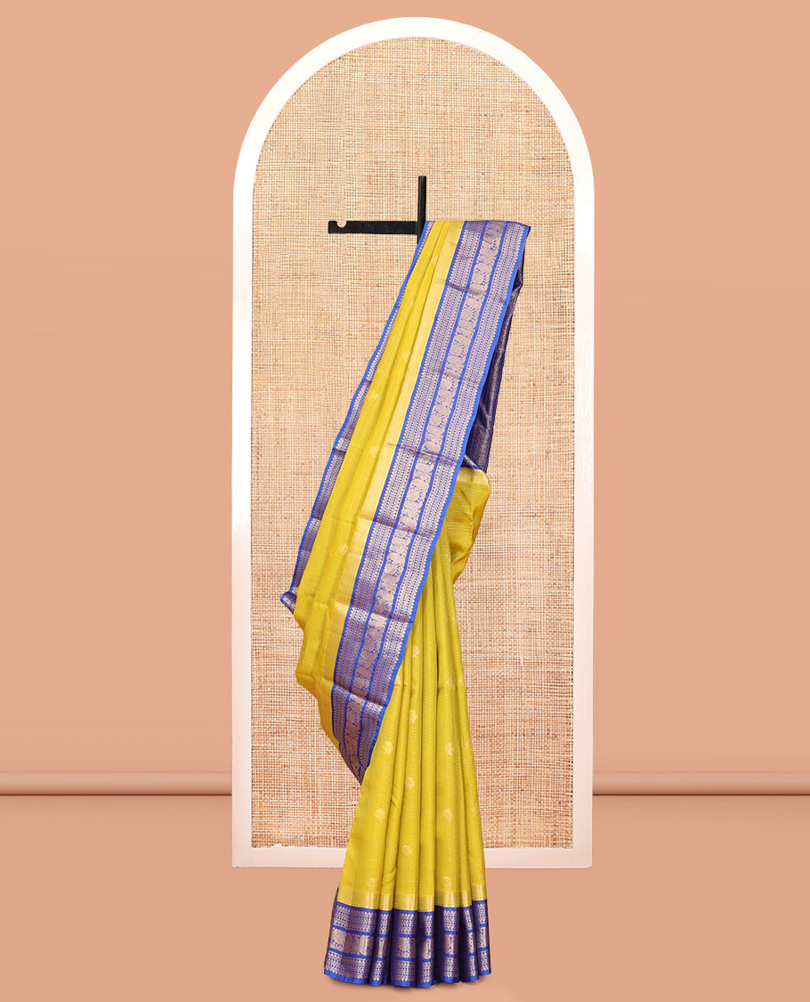 Green Vasundhara Lite Silk Mix Saree, Beautified with Zari Buttas and Checks, a Contrast Border of Kathir, Neli, Rekku, Thilakam Mokku, Manga, and Mayil Designs, Grand Pallu, and a Contrast Blouse