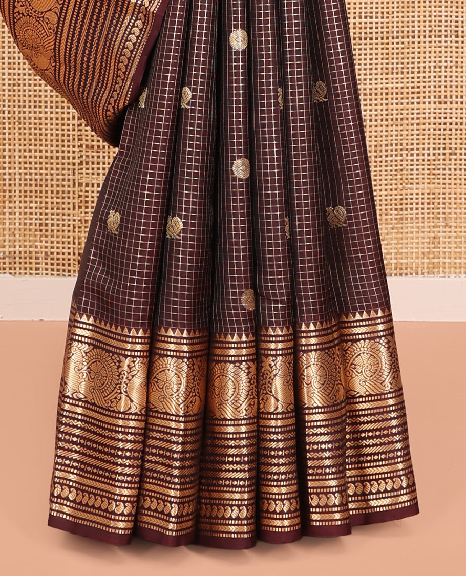 Brown Vasundhara Silk Saree, Masterfully Woven with Zari Buttas and Checks All Over Its Body, Highlighted by  Zari Border of Rekku, Muthu, Kathir, Mayil, Neli, and Manga Designs, Grand Pallu, and Paired with a Contrast Blouse