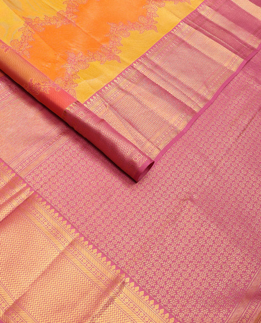 Yellow rangkat-style floral vine wedding silk saree, contrast border of thilakam mokku, banaras, rudraksham & vanki designs