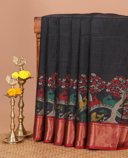 Black skirt-style kalamkari printed dola silksaree, contrast copper zari border,flora-fauna print pallu & zari border blouse