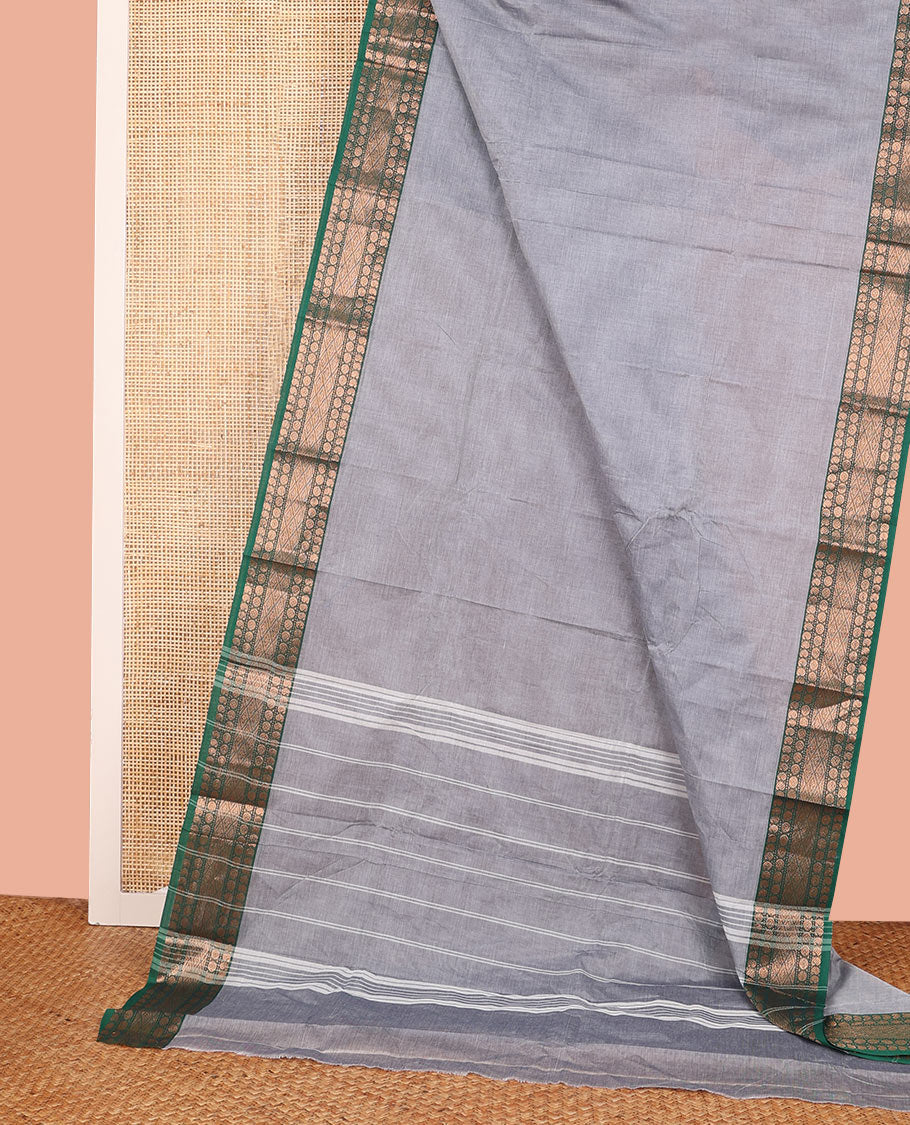 Grey Plain Chettinad Cotton Saree, Complemented by a Contrast Traditional Motifs Woven Zari Border, Subtly Striped Pallu, and Paired with a Matching Blouse
