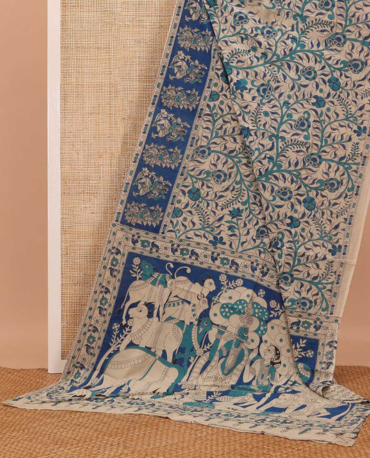 Blue floral vine machine printed kalamkari cotton saree, figurines motifs border, and pallu of pichwai cow, and Lord Kishna motifs