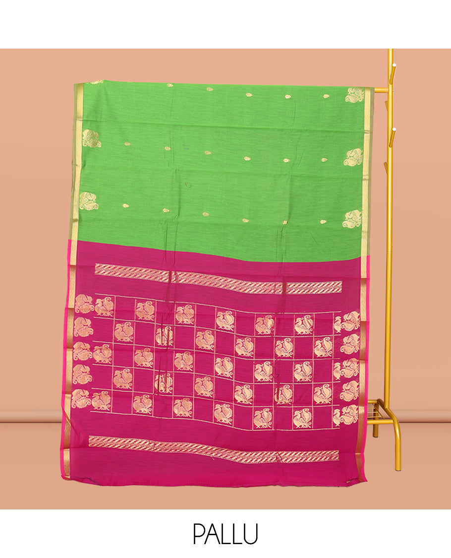 Parrot Green Semi-Silk Cotton Saree, Adorned with Buttas and Peacock Buttas All Over Its Body, Complemented by a Contrast Piping Border, Pallu of Peacock Butta Enclosed in a Checked Design, and Paired with a Contrast Blouse