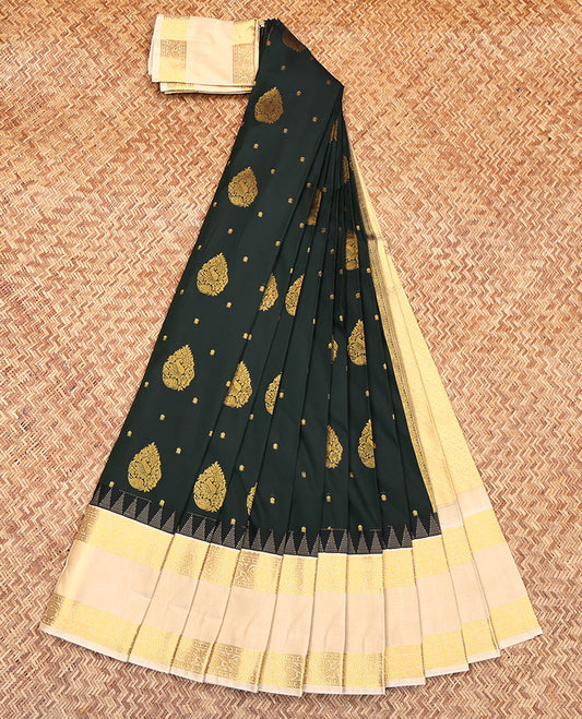 Green Budget Silk Saree, Beautifully Bedecked with Zari Buttas All Over Its Body, Complemented by a Contrast Traditional Zari Design Rettai Pettu Temple Border, Sparsely Woven Pallu, and Paired with a Contrast Blouse