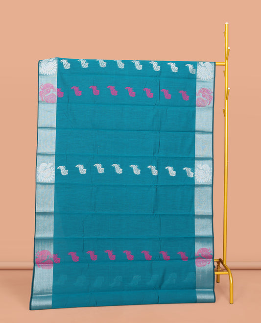 Blue Semi-Silk Cotton Saree, Beautified with Peacock Buttas All Over Its Body, Highlighted by a Zari Border of Peacocks, Pallu Woven with Peacock Designs, and Paired with a Matching Blouse