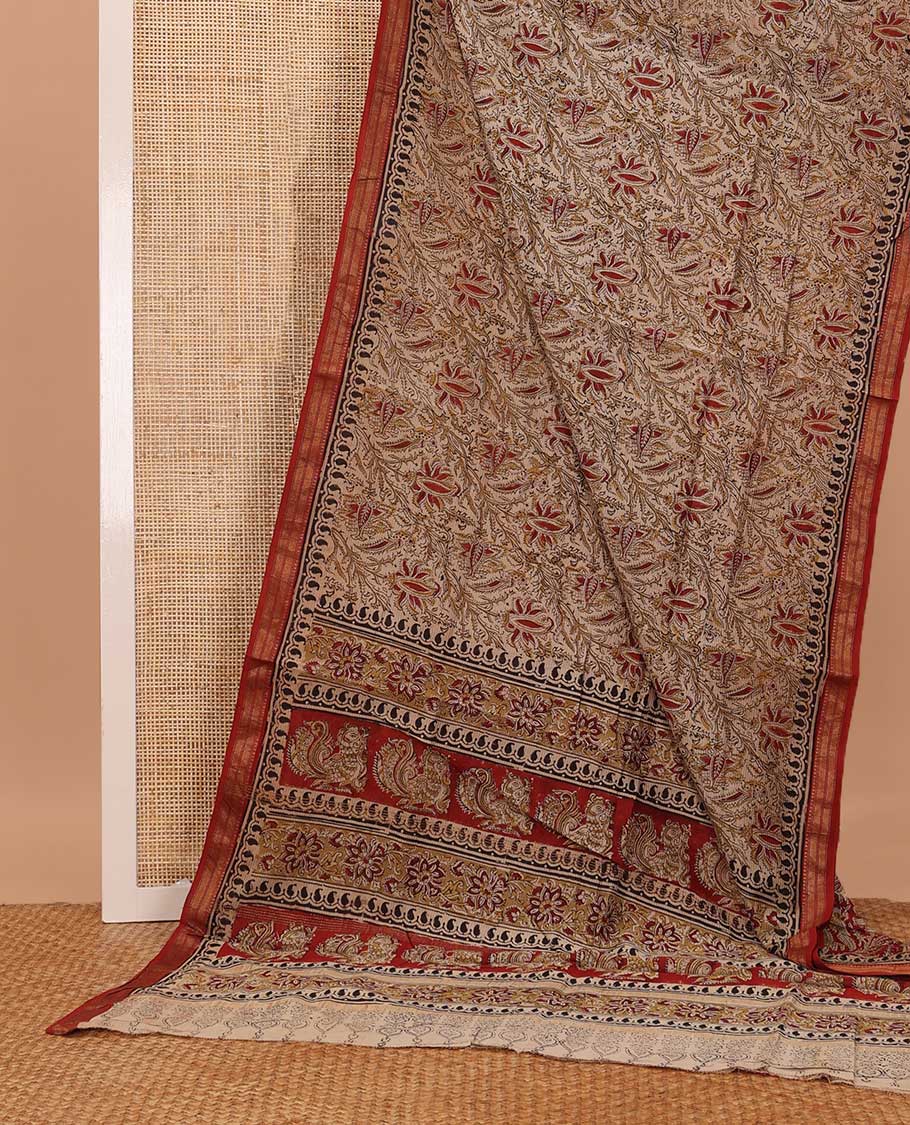 Fawn color floral machine printed kalamkari cotton saree, contrast traditional zari border, and pallu of floral-peacock print