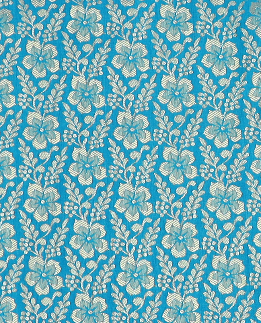 Blue Art Silk Material Half Saree Set Featuring Jacquard Skirt, a Contrast Traditional Zari Design Border, a Zari-Bordered Blouse, and a Dhavani Ornamented with Floral Zari Designs