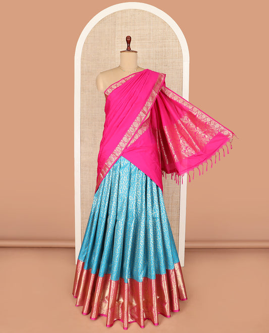 Blue Art Silk Material Half Saree Set Featuring Jacquard Skirt, a Contrast Traditional Zari Design Border, a Zari-Bordered Blouse, and a Dhavani Ornamented with Floral Zari Designs