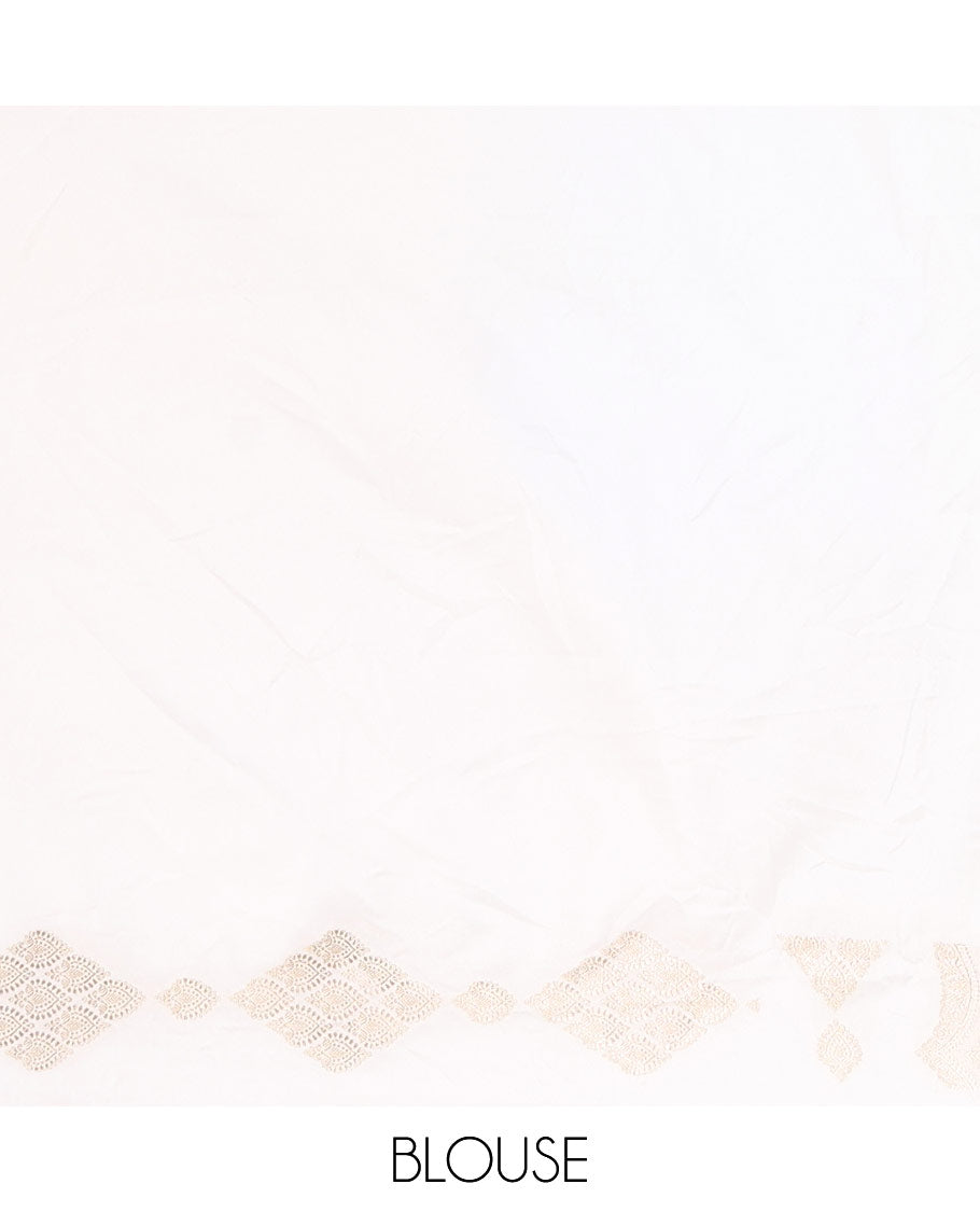 Borderless white zari buttas and diamond buttas mushru silk saree, intricately designed pallu, and a matching blouse