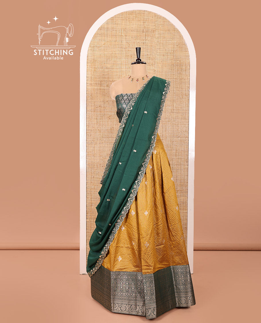 Yellow and Green Banaras Silk Half-Saree Featuring Zari Checks and Zari Buttas All Over the Skirt, Complemented by Contrast Traditional Zari Design Border, Paired with a Jacquard Blouse, and a Rangoli Georgette Dhavani of Embroidery and Scallop Border