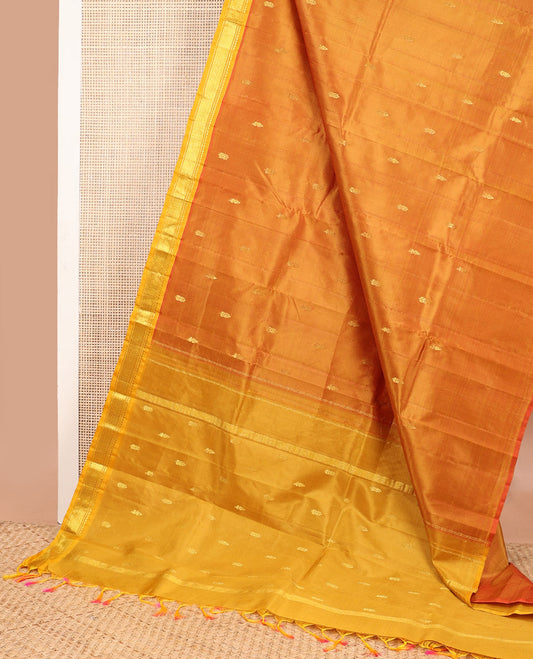 Orange floral buttas kancheepuram silk saree with contrast border of zari design border & floral design pallu